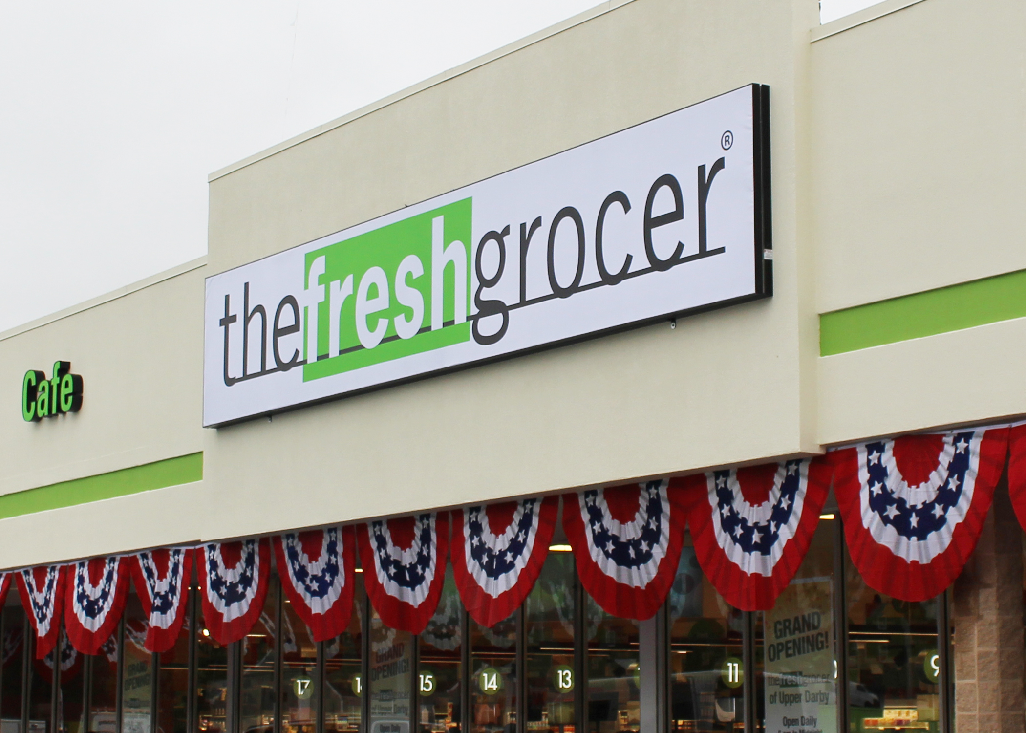 The Fresh Grocer building with large sign.